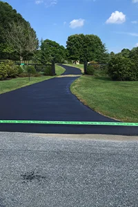 Image of a newly repaired asphalt walking path in a park