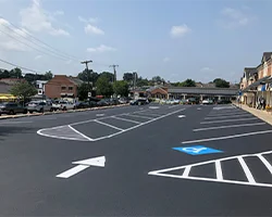 Image of a newly repaired asphalt parking lot in a plaza