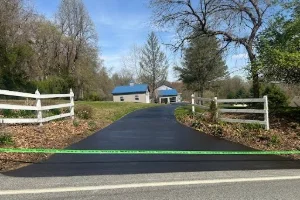 Image of a residential driveway being sealcoated in Bucks County, PA