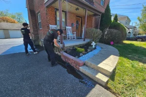 A residential driveway in the process of sealcoating - Superior Sealcoating in Collegeville, PA - Superior Sealcoating