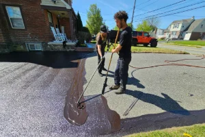 A residential driveway in the process of sealcoating - Superior Sealcoating in King of Prussia, PA - Superior Sealcoating