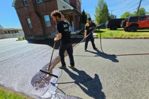 A residential driveway in the process of sealcoating - Superior Sealcoating in Norristown, PA - Superior Sealcoating