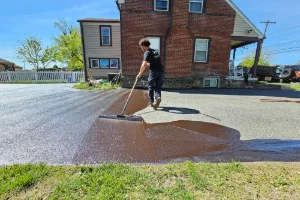 A residential driveway in the process of sealcoating - Superior Sealcoating in Phoenixville, PA - Superior Sealcoating