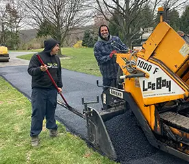 team members doing seal coating