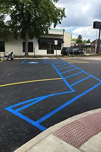 Image of a newly sealcoated parking lot for a small business