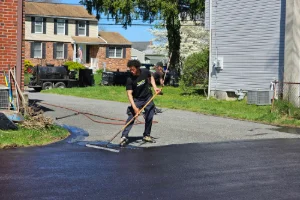 Image of a freshly sealcoated residential driveway