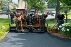 Superior Sealcoating employees paving a reseidential driveway - Paving in Coatesville, PA - Superior Sealcoating