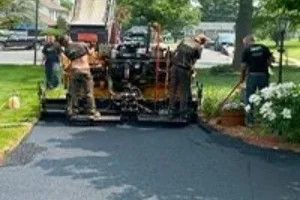 Superior Sealcoating employees paving a residential driveway - Paving in Exton, PA - Superior Sealcoating