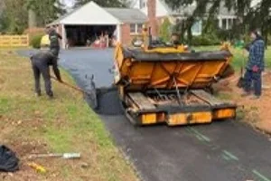 A residential driveway in the process of being paved - Paving in West Chester, PA - Superior Sealcoating