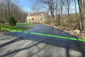 Image of a residential driveway being sealcoated