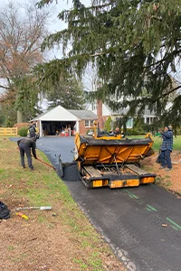 Image of a residential driveway in the process of sealcoating in West Chester, PA